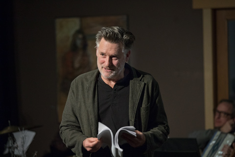 Actor Bill Pullman reading from a script