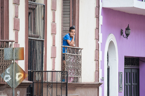 Boy on balcony Panama City Central America