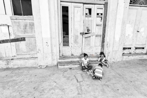 children playing board game on street panama city panama central america