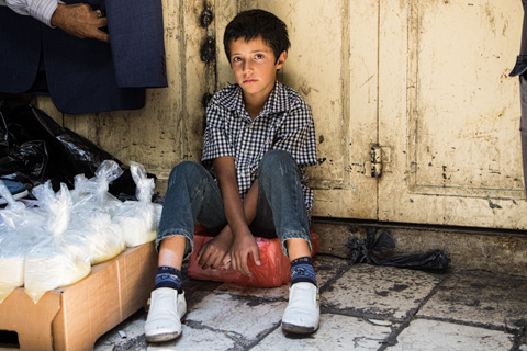 young boy in market in Jerusalem, Israel